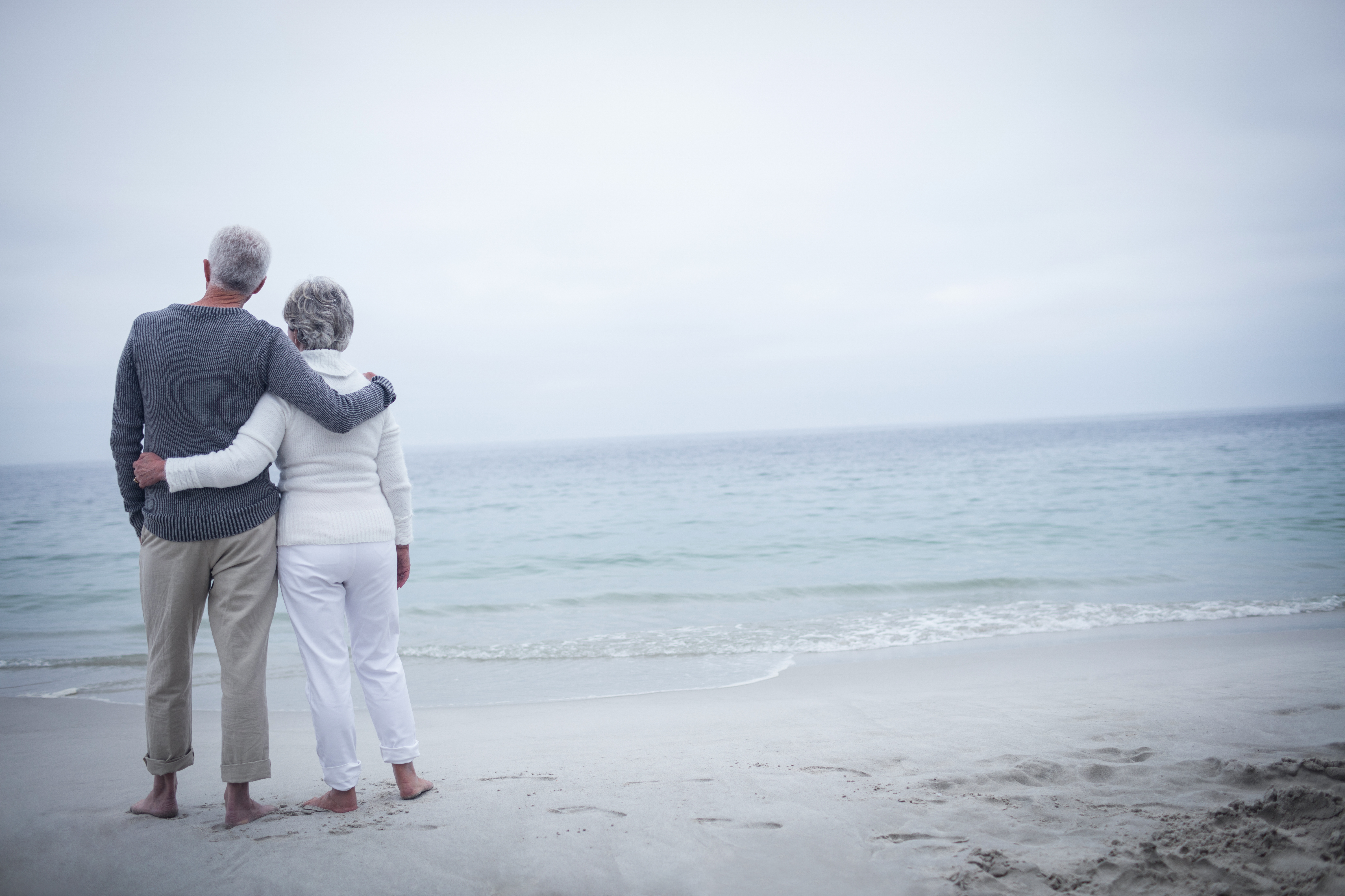 Retired couple looking at the ocean